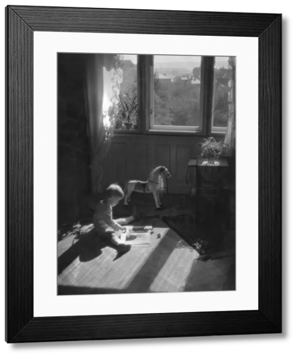 Framed Print : Boy Reading in Nursery Framed Print : Boy Reading in Nursery