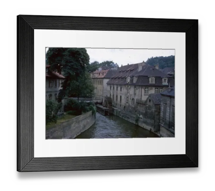 Framed Print : View of a river with buildings and waterwheel Framed Print : View of a river with buildings and waterwheel