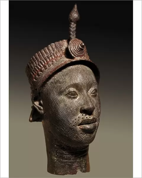 Bronze head with beaded crown and plume. 12th-14th