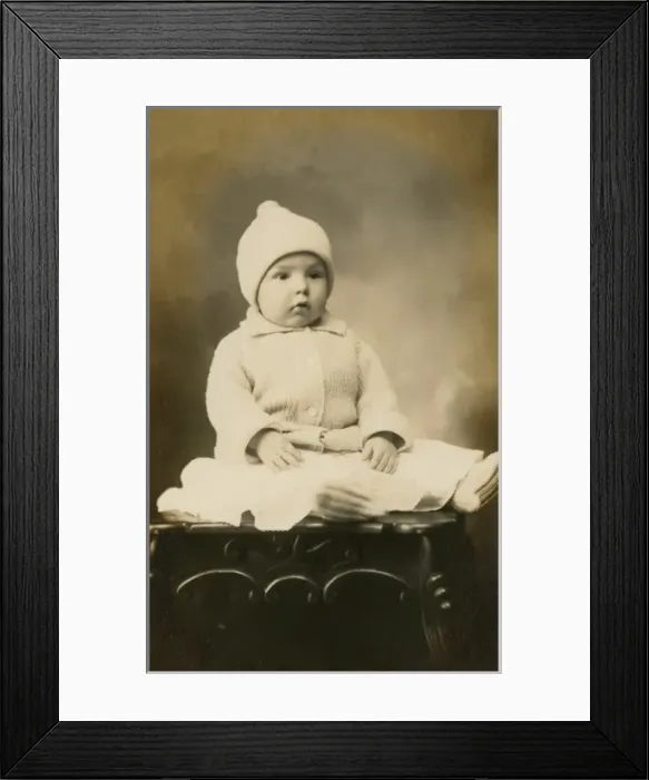 Framed Print : Adorable baby in woollen hat and cardigan Framed Print : Adorable baby in woollen hat and cardigan