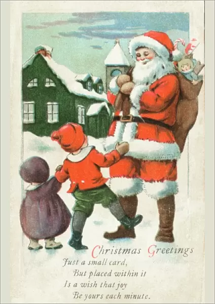 Two children meet Father Christmas in the snow