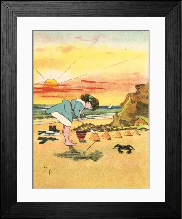 Framed Print : Girl making sandcastles at seaside Framed Print : Girl making sandcastles at seaside