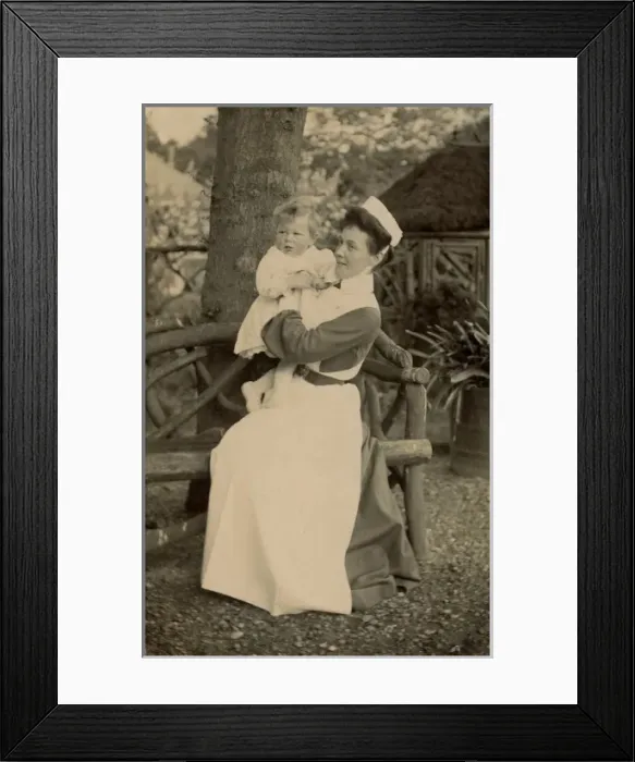 Framed Print : Nurse holding an infant Framed Print : Nurse holding an infant