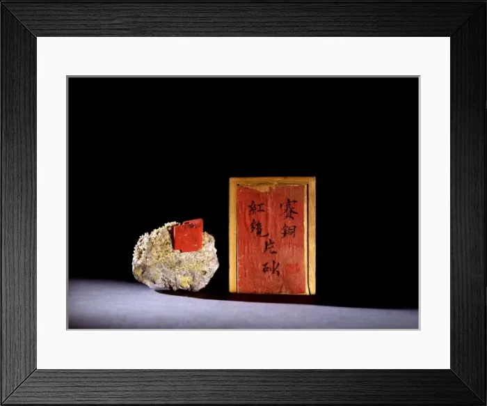 Framed Print : Cinnabar. A bright-red rhomobhedral crystal of cinnabar on a matrix Framed Print : Cinnabar. A bright-red rhomobhedral crystal of cinnabar on a matrix