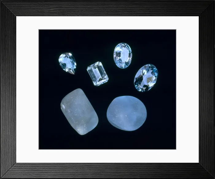 Framed Print : Topaz. Blue irradiated topaz pebbles and faceted topaz Framed Print : Topaz. Blue irradiated topaz pebbles and faceted topaz