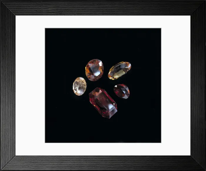 Framed Print : Garnets. Faceted garnets showing a range of colours. Garnet is the birthstone of January Framed Print : Garnets. Faceted garnets showing a range of colours. Garnet is the birthstone of January