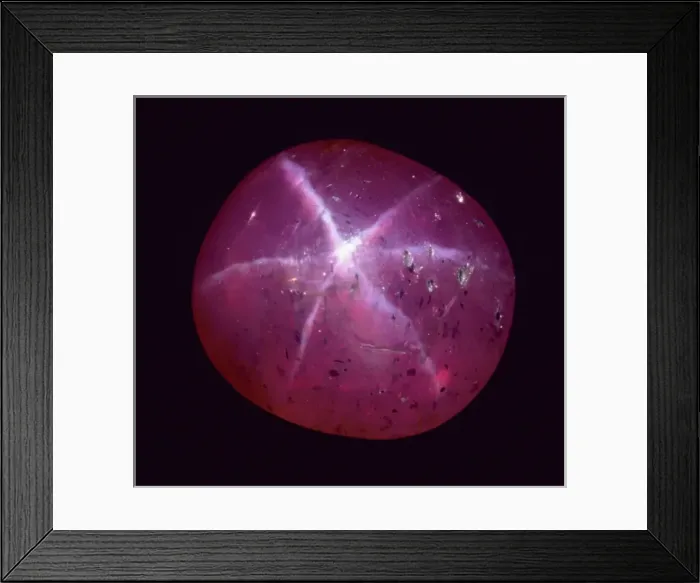 Framed Print : Ruby. A six-rayed star ruby. Ruby is the red variety of the mineral corundum Framed Print : Ruby. A six-rayed star ruby. Ruby is the red variety of the mineral corundum