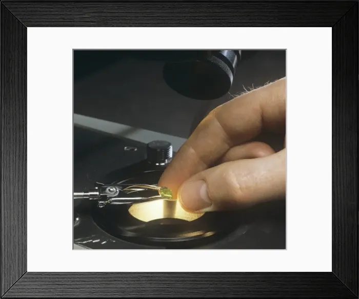Framed Print : Emerald. An emerld under analysis. Emerald is a variety of beryl Framed Print : Emerald. An emerld under analysis. Emerald is a variety of beryl