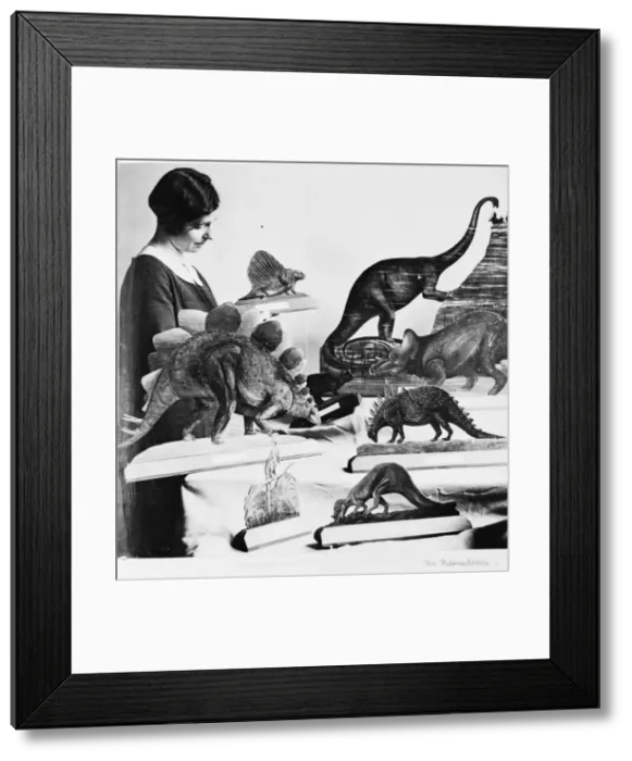 Framed Print : Woman with dinosaur models, 1926 Framed Print : Woman with dinosaur models, 1926
