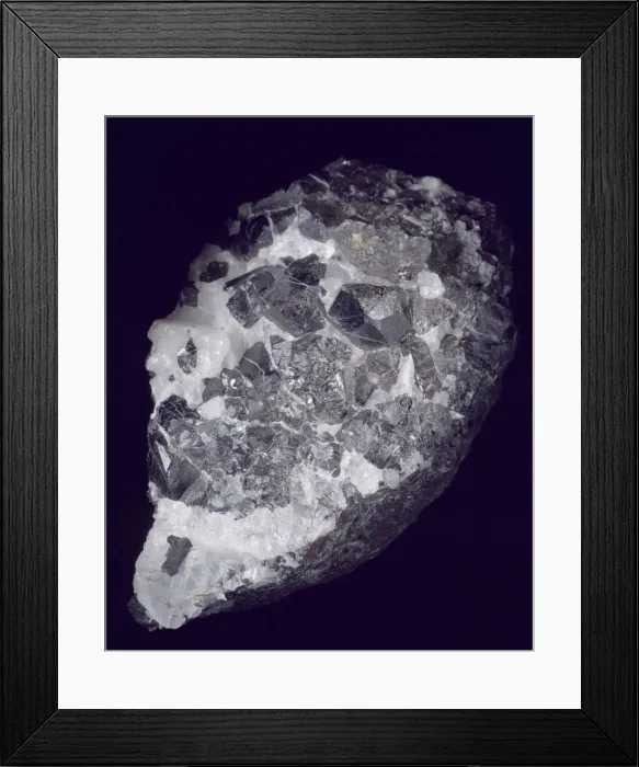 Framed Print : Braunite is a native oxide of manganese. Its crystals are dark brownish black in colour Framed Print : Braunite is a native oxide of manganese. Its crystals are dark brownish black in colour