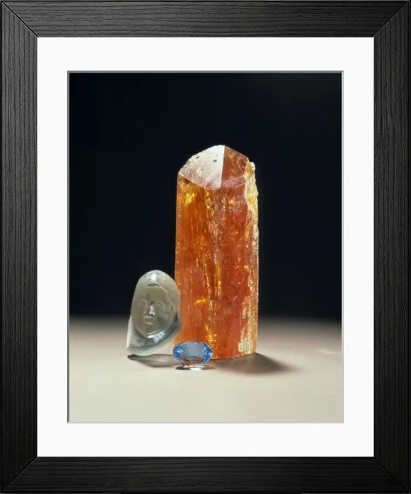 Framed Print : Crystal, carving and treated blue topaz Framed Print : Crystal, carving and treated blue topaz