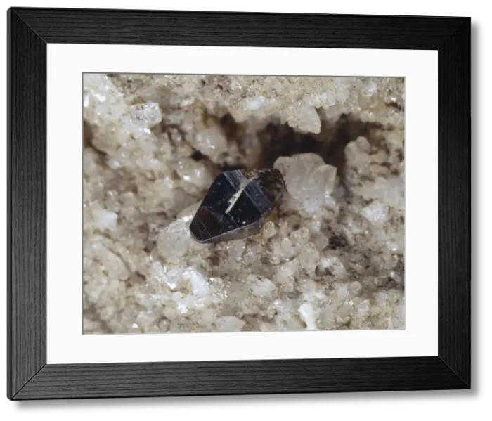 Framed Print : Anatase. A brown to black single tetragonal crystal of anatase (titanium oxide) Framed Print : Anatase. A brown to black single tetragonal crystal of anatase (titanium oxide)