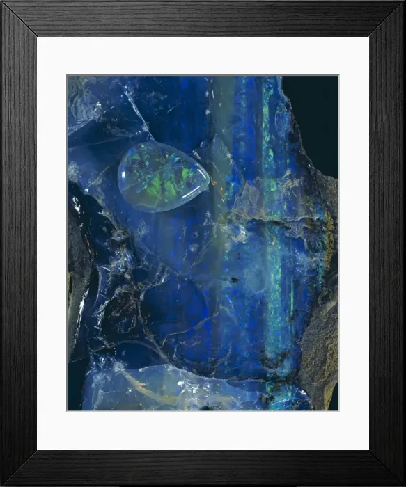 Framed Print : Opal. A cut stone and crystal of opal. Opals are not truely crystalline Framed Print : Opal. A cut stone and crystal of opal. Opals are not truely crystalline