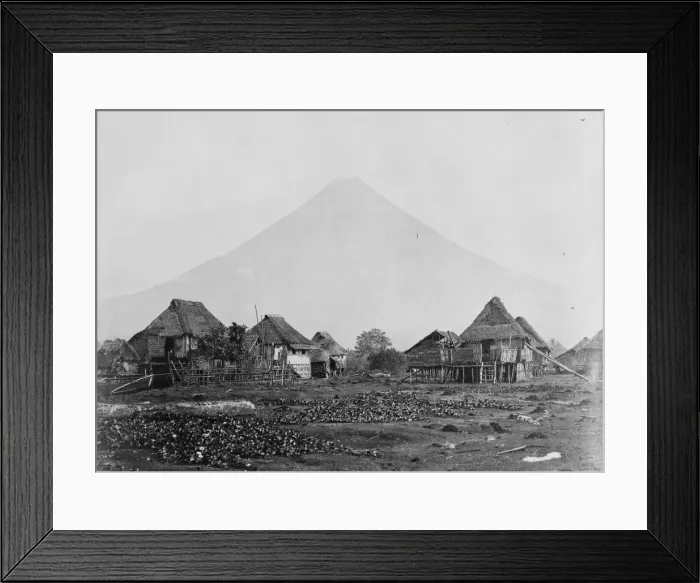Framed Print : Volcano with straw roofed house in foreground, Moluccas, Ind Framed Print : Volcano with straw roofed house in foreground, Moluccas, Ind