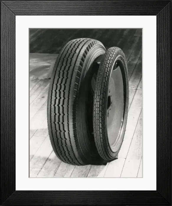 Framed Print : Dunlop spare wheel compared with standard Framed Print : Dunlop spare wheel compared with standard