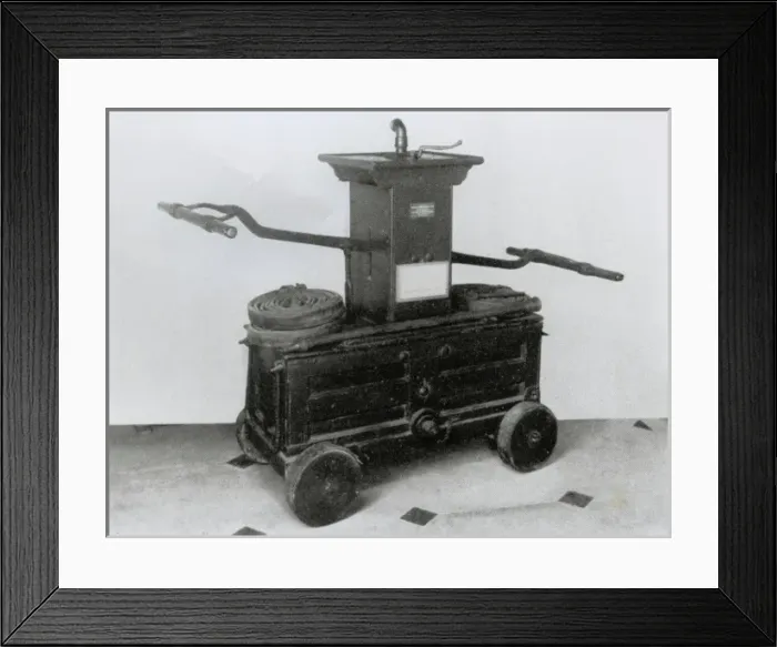 Framed Print : 18th century fire engine with leather hose and other fitting Framed Print : 18th century fire engine with leather hose and other fitting