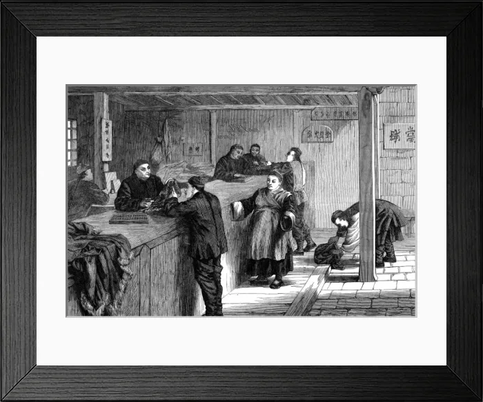 Framed Print : A pawnbroker in Shanghai does business with his customers Framed Print : A pawnbroker in Shanghai does business with his customers
