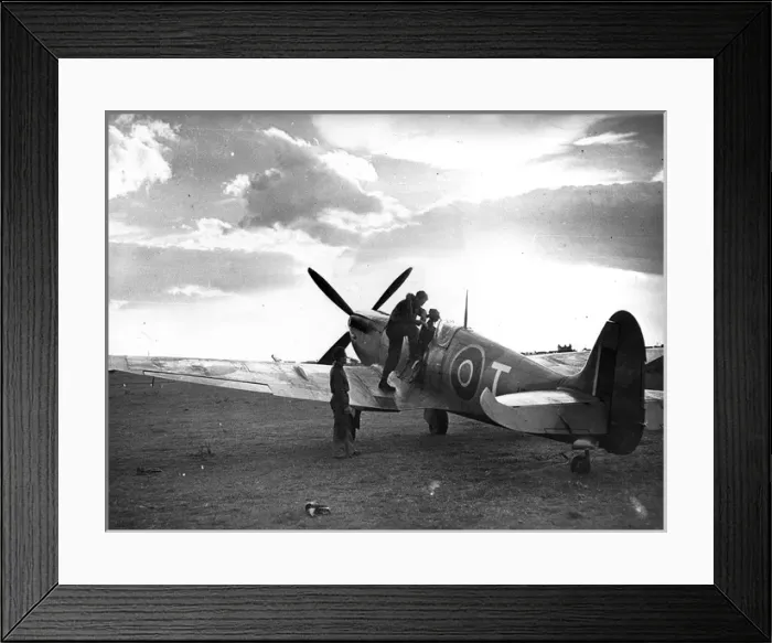 Framed Print : A pilot is about to climb into his Supermarine Spitfire IX Framed Print : A pilot is about to climb into his Supermarine Spitfire IX
