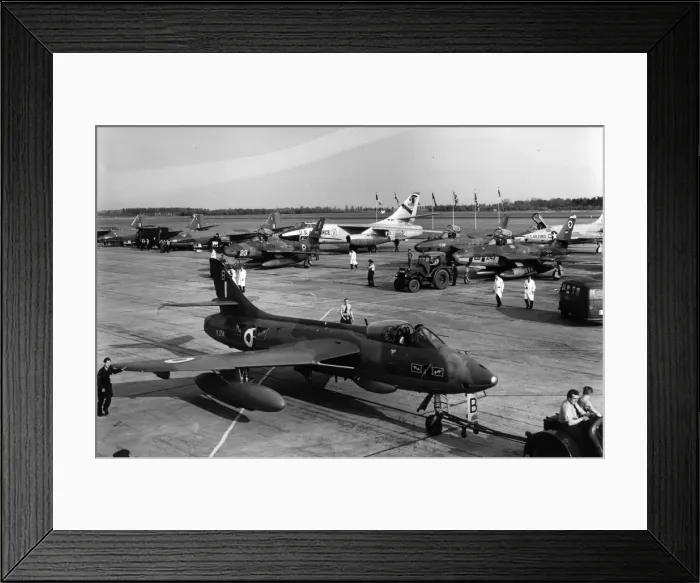 Framed Print : Hawker Hunter F6 XJ714 is towed past a line-up of aircraft Framed Print : Hawker Hunter F6 XJ714 is towed past a line-up of aircraft