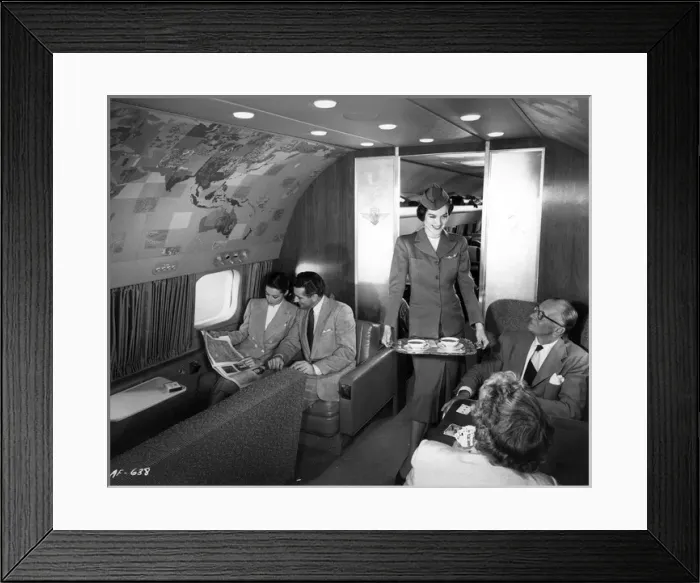 Framed Print : A stewardess serves tea Framed Print : A stewardess serves tea