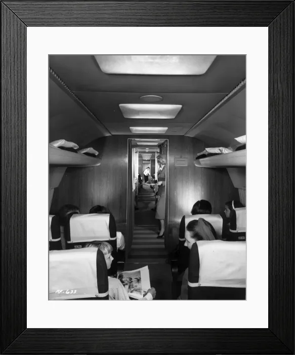 Framed Print : A stewardess serves drinks Framed Print : A stewardess serves drinks