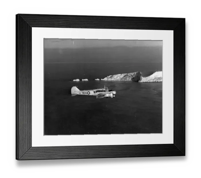 Framed Print : Avro Anson I MK614 of the Royal Navy flies past the Needles Framed Print : Avro Anson I MK614 of the Royal Navy flies past the Needles