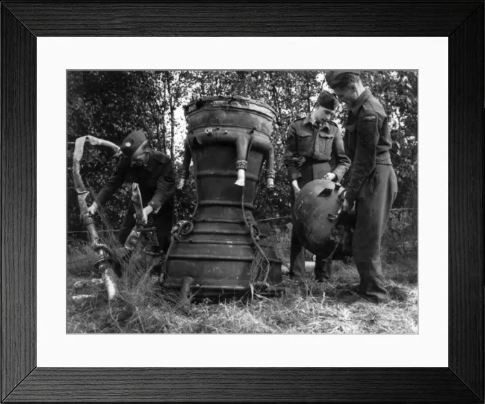 Framed Print : RAF personnel inspect the remains of a V-2 Framed Print : RAF personnel inspect the remains of a V-2