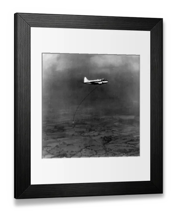 Framed Print : A geophysical survey bird towed by de Havilland DH104 Dove