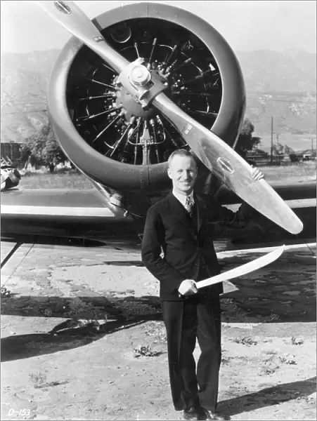 Sir Charles Kingsford Smith in front of his Lockheed Altair