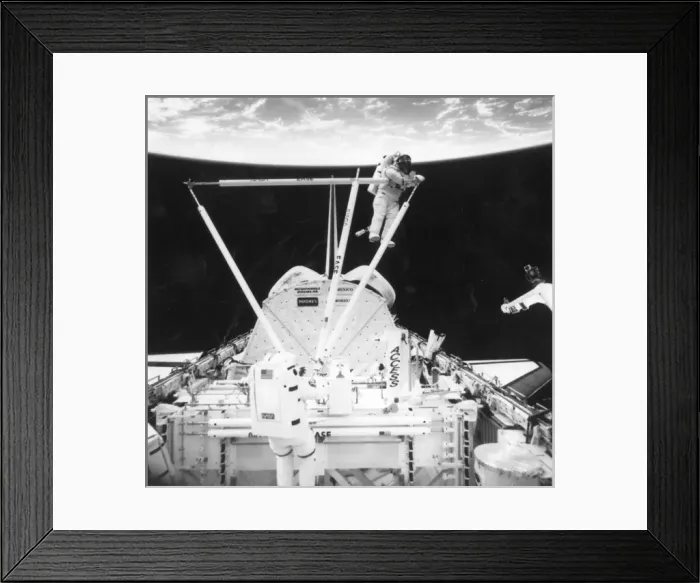 Framed Print : Astronauts during an EVA outside a Space Shuttle Framed Print : Astronauts during an EVA outside a Space Shuttle