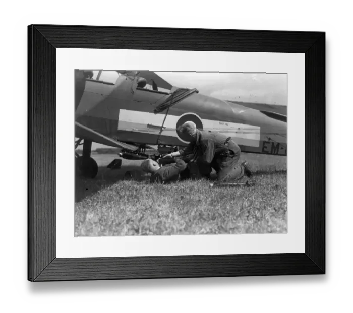 Framed Print : A de Havilland DH82A Tiger Moth is bombed-up at Hatfield Framed Print : A de Havilland DH82A Tiger Moth is bombed-up at Hatfield