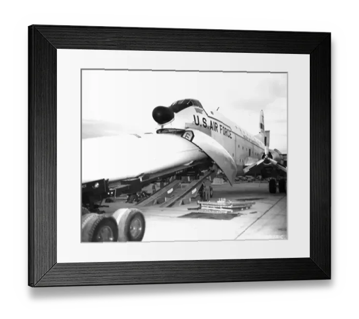 Framed Print : A Thor missile is loaded into a Douglas C-124 Globemaster II Framed Print : A Thor missile is loaded into a Douglas C-124 Globemaster II