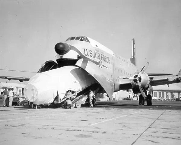 A Thor missile is loaded into a Douglas C-124 Globemaster II