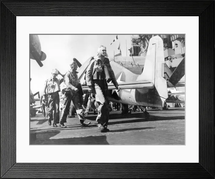Framed Print : Pilots walk past a Grumman F6F Hellcat on a carrier deck Framed Print : Pilots walk past a Grumman F6F Hellcat on a carrier deck