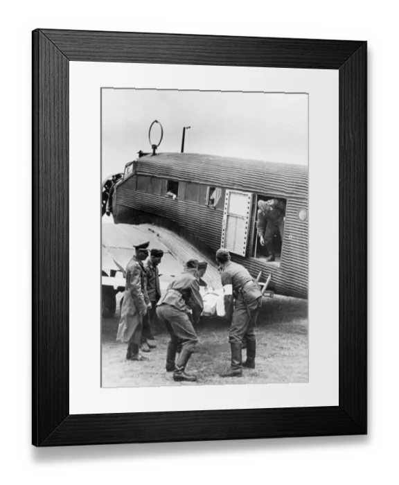 Framed Print : A military Junkers Ju52 / 3m being loaded with a casualty Framed Print : A military Junkers Ju52 / 3m being loaded with a casualty