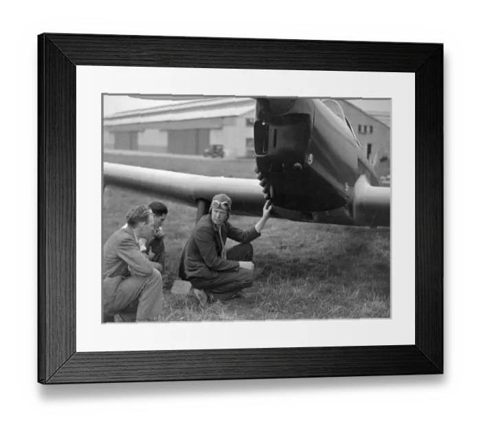 Framed Print : Charles A Lindbergh inspects his Miles M12 Mohawk G-AEKW