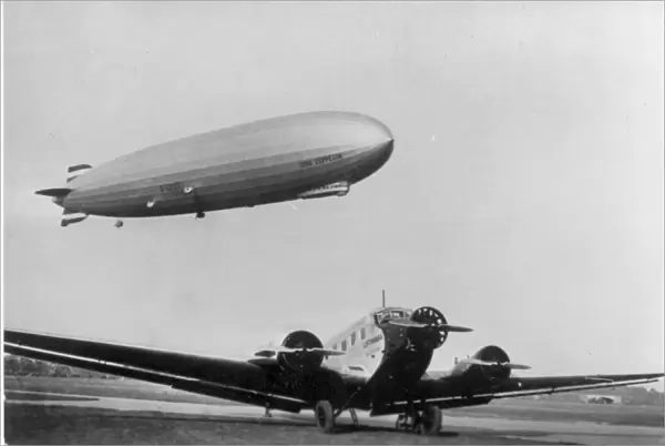 The Graf Zeppelin LZ 127 over a Junkers Ju52  /  3m of Lufthansa