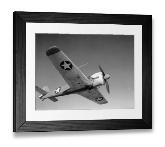 Framed Print : A captured Focke-Wulf Fw190 in US markings over North Africa Framed Print : A captured Focke-Wulf Fw190 in US markings over North Africa