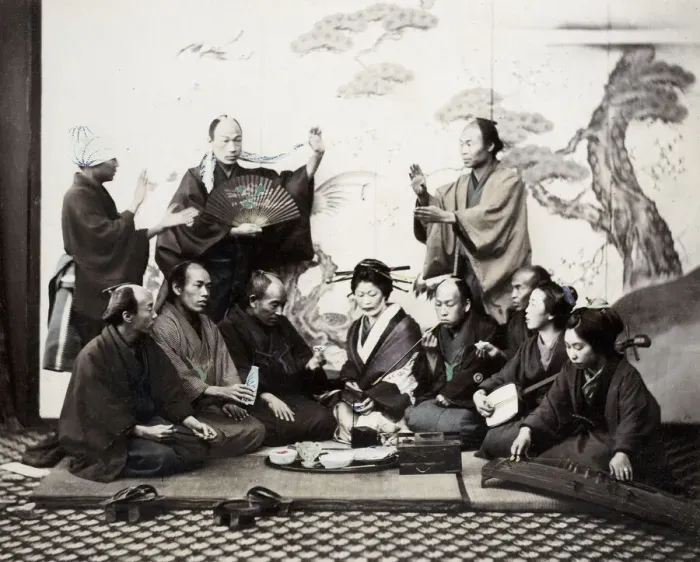 Framed Print : 1860s Japan - portrait of a group of men and women enjoying a social meal with music Framed Print : 1860s Japan - portrait of a group of men and women enjoying a social meal with music