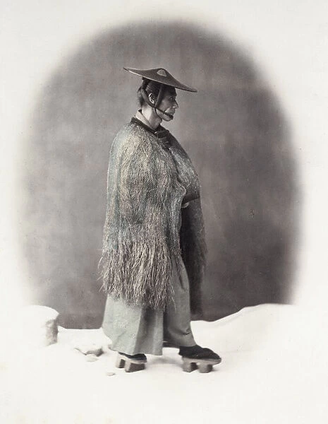 1860s Japan - portrait of a man in a straw rain coat Felice or Felix Beato