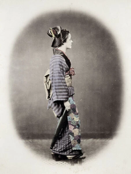 1860s Japan - portrait of a young woman in an ornate kimono