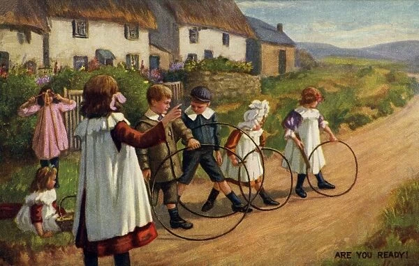 Hoops. Artist Anon. Children playing hoops on a country road Date: 1911