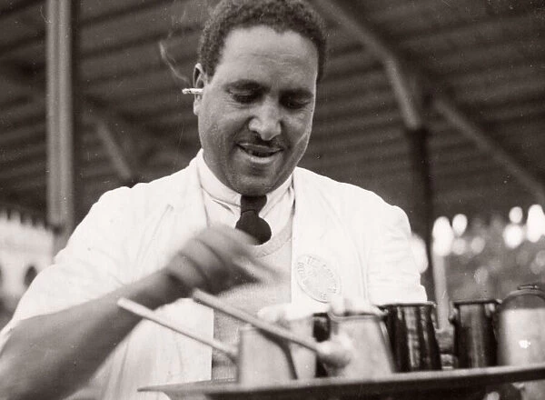 1943 Egypt waiter serving coffee with cigarette in ear