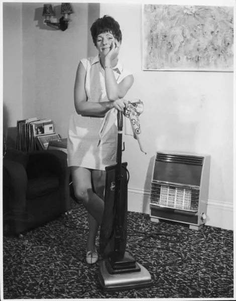 1960s British Housewife with Hoover Print. Art Prints, Posters & Puzzles  from Mary Evans