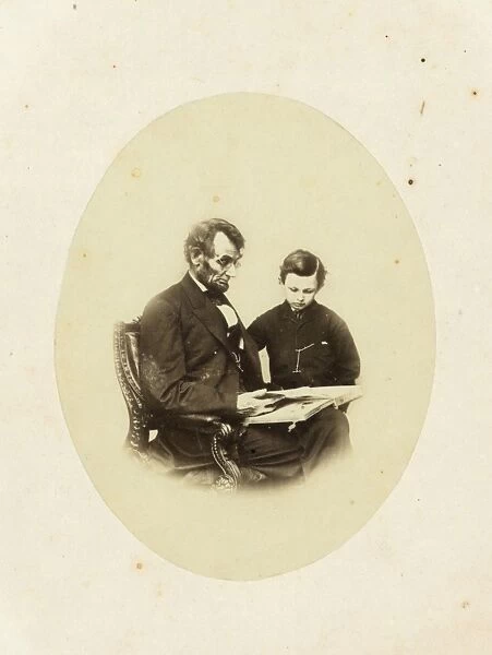 Abraham Lincoln, US President, looking at a photo album with
