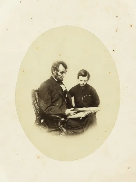Framed Print : Abraham Lincoln, US President, looking at a photo album with Framed Print : Abraham Lincoln, US President, looking at a photo album with