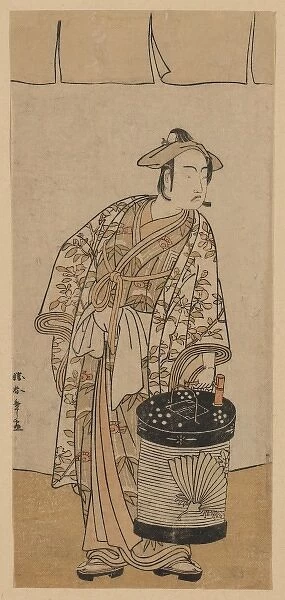 The actor Ichikawa Monnosuke II holding a box lantern