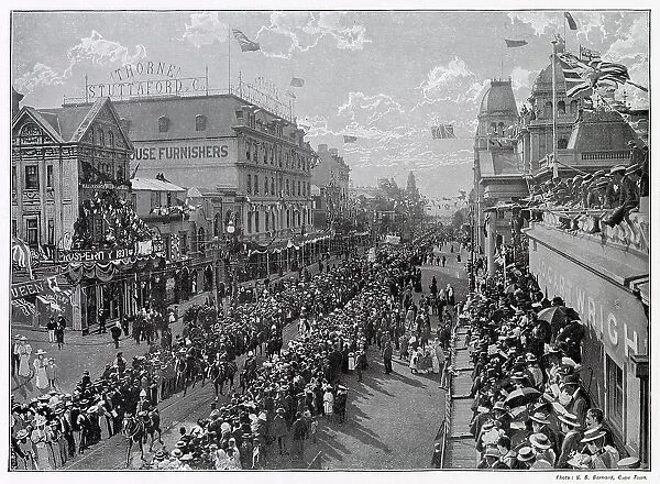 Adderley Street, crowds gather to watch thoroughfare going past, with British Union Jack flying proudly from the buildings. Date: 22nd June 1897