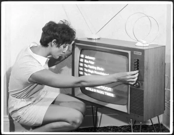 Framed Print : Adjusting a TV Set Framed Print : Adjusting a TV Set