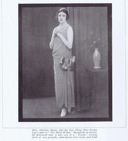 Adrienne Brune, in an evening frock created by Ninette, Lond